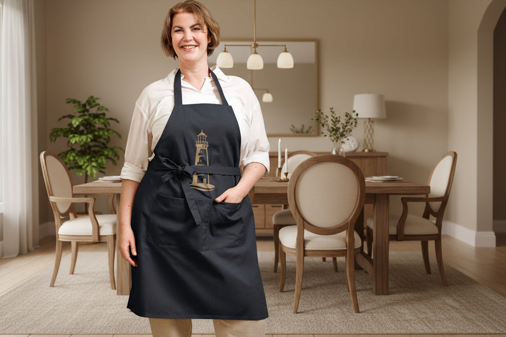 Küchenschürze in schwarz aus Bio-Baumwolle mit Leuchtturm-Motiv der Nordsee-Serie